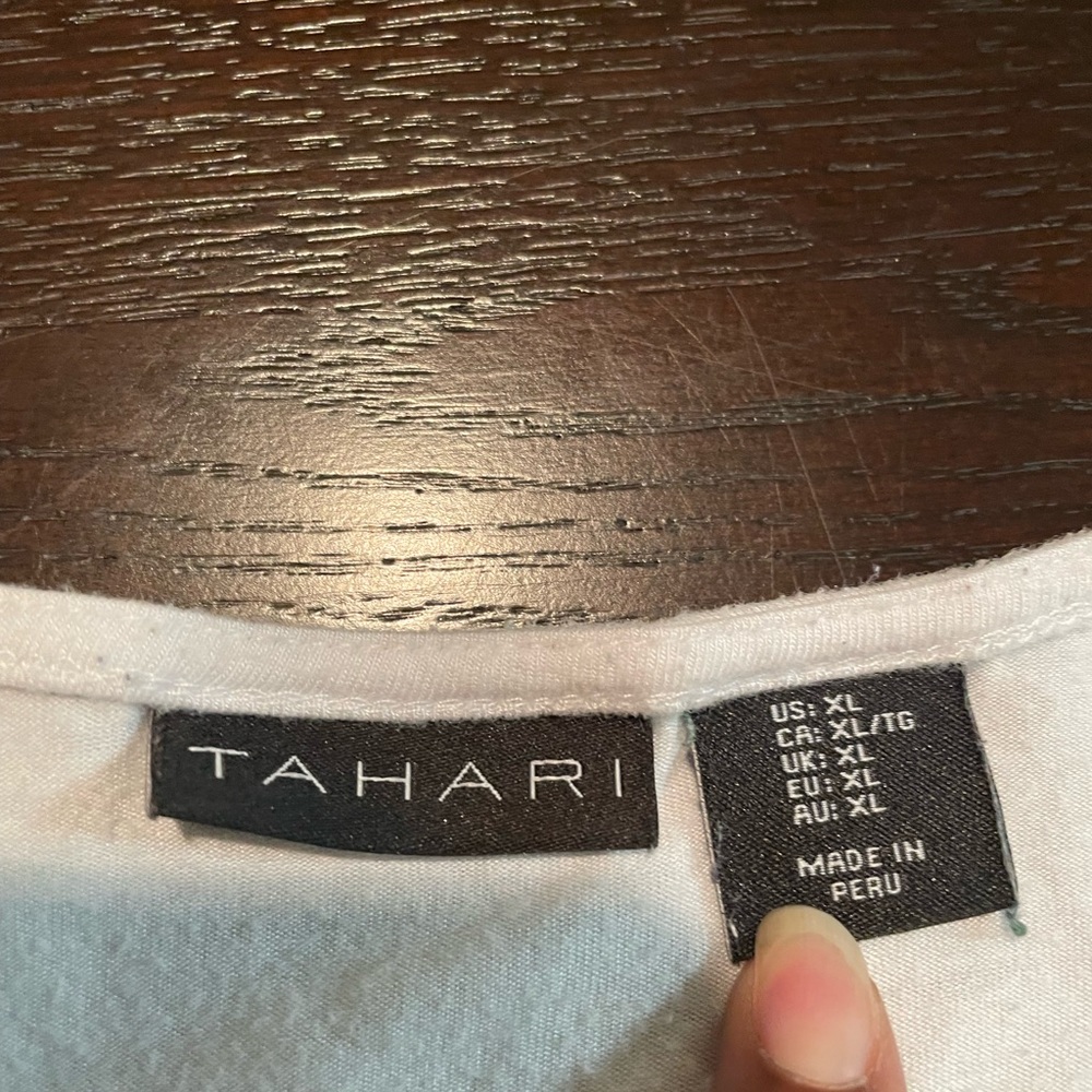 White is pure so be pure with this Tahari shirt.